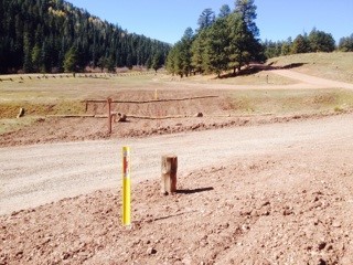 A pipeline marker on private property.